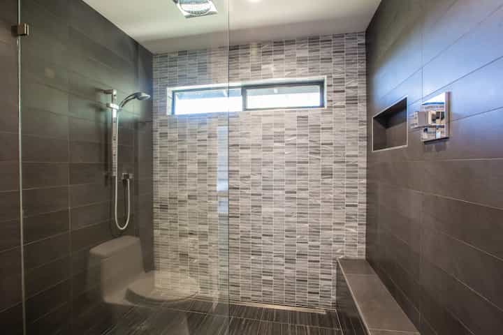 Interior of Malibu, California bathroom gets a dark marble shower installation